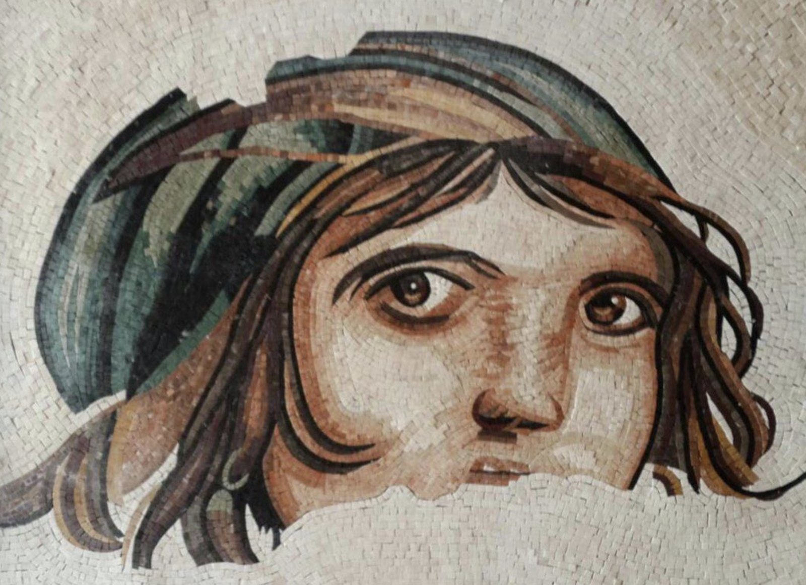Close-up of a classical female portrait mosaic, showing fine stone tesserae.